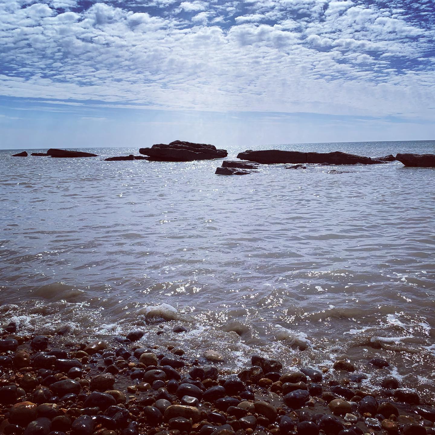 Sun dancing on the water.  #seasideliving #cambersands #ryeeastsussex #hastings
